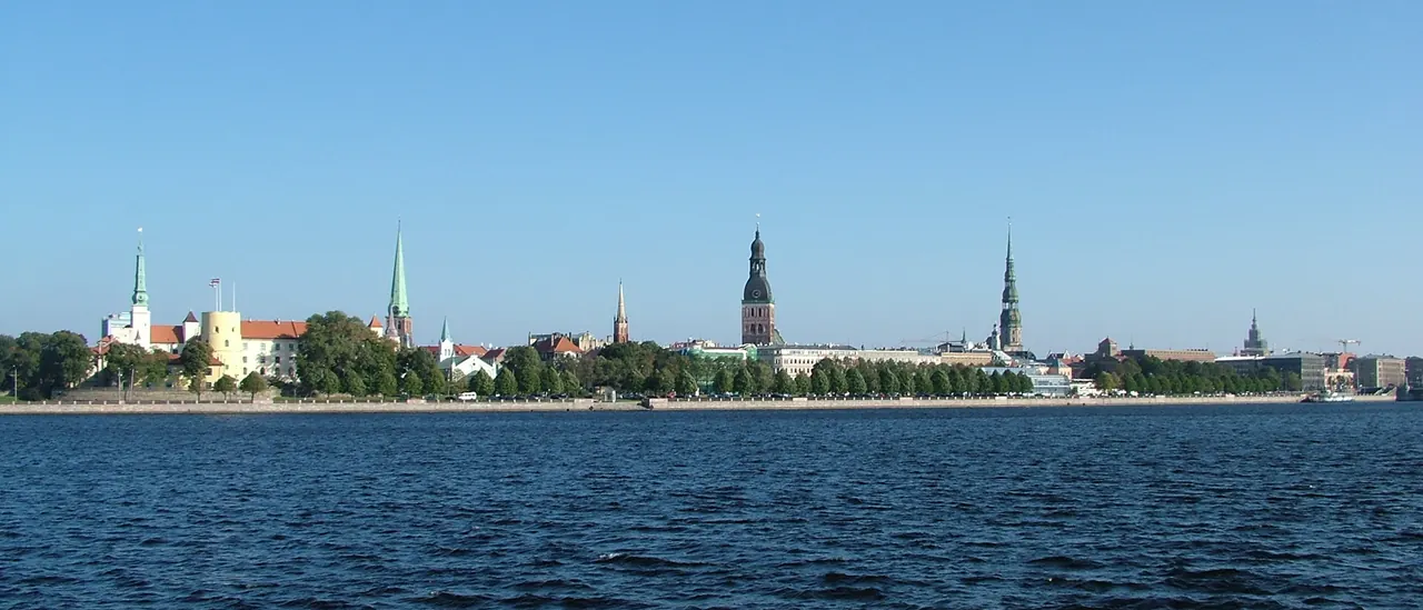 Riga old-town skyline and church spires viewed from across the Daugava River