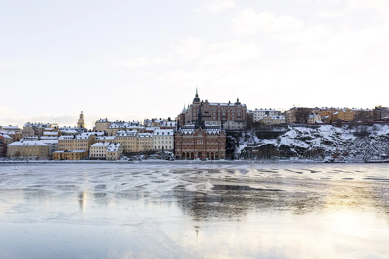 Stockholm waterfront buildings and Söder Mälarstrand seen across winter ice